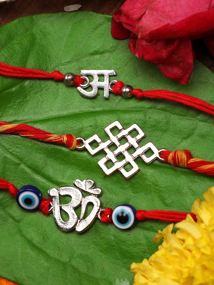 Necklaces Yellow Chimes Yellow Chimes Combo of 3 Pcs Handmade Dori Worked Silver Toned OM Initial Letter A and Celtic Design Evil Eye Beads Rakhi for Brother with Roli Chawal Red Silver Medium YCTJRK32BHAYSL