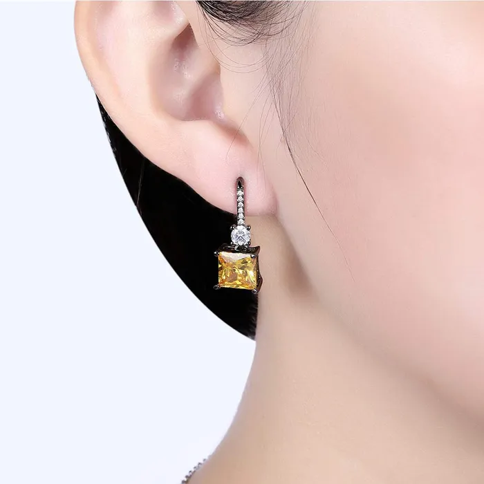 Yellow Chimes Earrings Yellow Chimes Combo of Two Pairs Classic Blue Royal Crystal Black Gun Plated Yellow Crystal Drop Earrings for Women and Girls