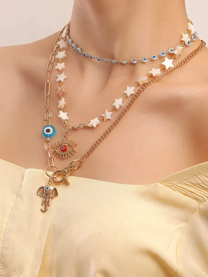 Yellow Chimes Necklace For Women Mixed Layered Chunky Gold Toned With Evil Eye Elephant Charm Beaded Star studded Neckchain For Women and Girls Yellow Chimes Earrings